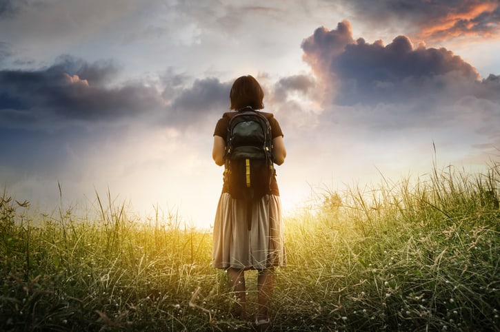 Woman with backpack representing Enneagram Transformation