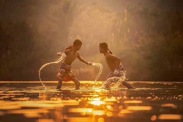 Boys fighting in water