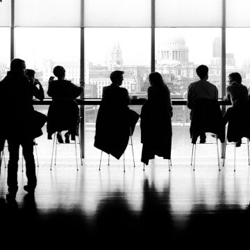 Silhouette of people in office setting representing Corporate Enneagram Training